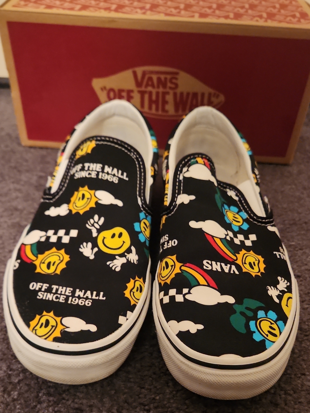 Vans Black Slip-On Sneakers with Yellow & Blue Smiley Pattern - Picture 1 of 5